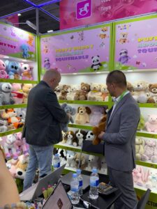 Buyers viewing plush toy samples at the Victory booth during Canton Fair 2026